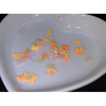 vlindertjes 0,5 cm. neon oranje tintjes